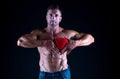 Heart protection. Romantic muscular guy. Man muscular macho romantic date. Fall in love sportsman. Bodybuilder muscular