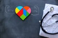 Heart puzzle over chalkboard, medical concept