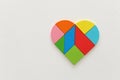 Heart puzzle on white wooden background Royalty Free Stock Photo