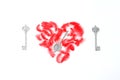 heart of red feathers and a silver key. composition for St. Valentine`s Day. Flat lay, top view, creative concept