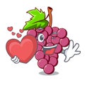 With heart red grapes fruit above mascot table Royalty Free Stock Photo