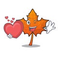 With heart red maple leaf mascot cartoon