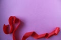 Heart of red ribbon on pink background with copyspace place for the text of the background Valentine`s Day lovers Royalty Free Stock Photo