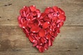 Heart of red rose petals on wooden. Valentine's Day, anniversary