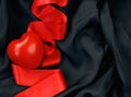 Heart, red satin ribbon, black silk Royalty Free Stock Photo