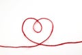 Heart from a red woolen thread on a white isolated background Royalty Free Stock Photo