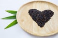 Heart rice berry in wooden bowls and green pandan