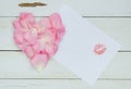 Heart from rose petals, free space for your text with Lipstick kiss Royalty Free Stock Photo