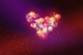 Heart of salutes on Valentines day in an abstract red background with glowing stars and bokeh in the form of design decoration. Royalty Free Stock Photo