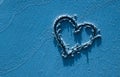 Heart and sand in blue Royalty Free Stock Photo