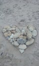 Heart in the sand rocks coral beach