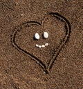 Heart in the sand. Sea background. Sea stones Royalty Free Stock Photo