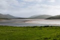 In Scotland\'s heart, Kyle of Durness offers a peaceful expanse of tidal flats framed by lush grass and mist-enshrouded hills Royalty Free Stock Photo