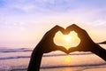 Heart shape, beach and sunset, symbol of romantic travels, love Royalty Free Stock Photo