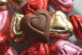 Heart shape chocolate candy red, pink, gold foil wrapped pieces Royalty Free Stock Photo