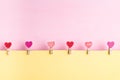 Heart shape clothespin with yellow and pink background Royalty Free Stock Photo
