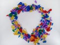 Heart shape with colorful beads on a white background