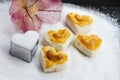 Heart shape cookies with cashew nut or Singapore Cookie on the pile white granulated sugar for valentines day element concept Royalty Free Stock Photo