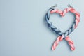 heart shape created with blue and pink twisted ribbons, symbolizing love and connection Royalty Free Stock Photo