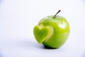 Heart shape cut in apple Royalty Free Stock Photo