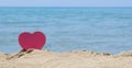 Heart shape dipped in sandy beach with the look at horizon Royalty Free Stock Photo