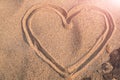 Heart shape drawing on the white sand nature between the rock, love in rock. summer trip Royalty Free Stock Photo