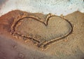 Heart shape drawn on the beach Royalty Free Stock Photo