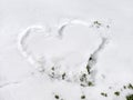 Heart shape drawn on the fresh snow. Winter nature background Royalty Free Stock Photo