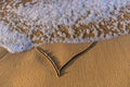 Heart shape drawn in the sand on a beach Royalty Free Stock Photo