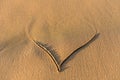 Heart shape drawn in the sand on a beach Royalty Free Stock Photo