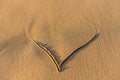 Heart shape drawn in the sand on a beach Royalty Free Stock Photo