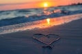 A heart shape drawn in the sand on a beach with footprints leading towards it, A soft focus image of a heartbeat line etched into Royalty Free Stock Photo