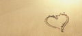 Heart shape drawn on smooth sand Royalty Free Stock Photo