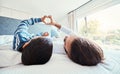 Heart shape, father and son on bed, quality time and happiness on break, relax and bonding together. Family, dad and boy Royalty Free Stock Photo