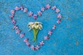 Heart shape formed from flowers on a blue background Royalty Free Stock Photo