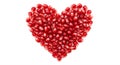 A heart shape is formed using numerous red pomegranate seeds (Punica granatum) Royalty Free Stock Photo