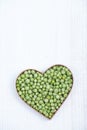 Heart shape with fresh green peas Royalty Free Stock Photo
