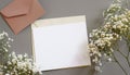 Styled stock photo. Feminine wedding desktop stationery mockup with blank greeting card, baby`s breath Gypsophila Royalty Free Stock Photo