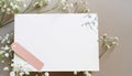 Styled stock photo. Feminine wedding desktop stationery mockup with blank greeting card, baby`s breath Gypsophila Royalty Free Stock Photo