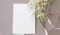 Styled stock photo. Feminine wedding desktop stationery mockup with blank greeting card, baby`s breath Gypsophila Royalty Free Stock Photo