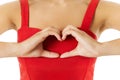 Heart Shape, Hands Gesture Sign. Woman in Red Showing Health Symbol