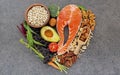 Heart shape of ingredients for healthy foods selection on dark stone background