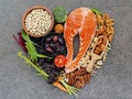 Heart shape of ingredients for healthy foods selection on dark stone background