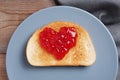 Heart shape jam on toasted bread