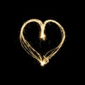 Heart shape lightpainting with sparklers isolated on black