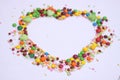 Heart shape made with beans and candies Royalty Free Stock Photo