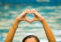 Heart shape made of beautiful hand come up from water Royalty Free Stock Photo