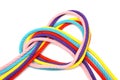 Heart shape made of five multicolored cords on white
