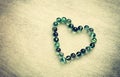 Heart shape made from marbles with vintage effect. valentines day concept or wedding concept. room for text.