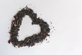 Heart shape made with a mixture of a variety of dried tea leaves